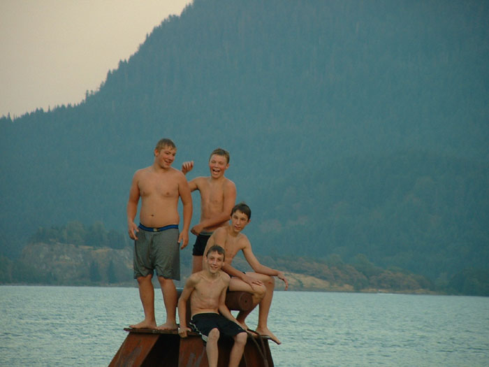 Local Kids strip to their skivvies and swim out to the pylon for a photo op